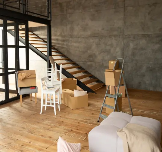 loft-style-basement-with-stairs-and-boxes