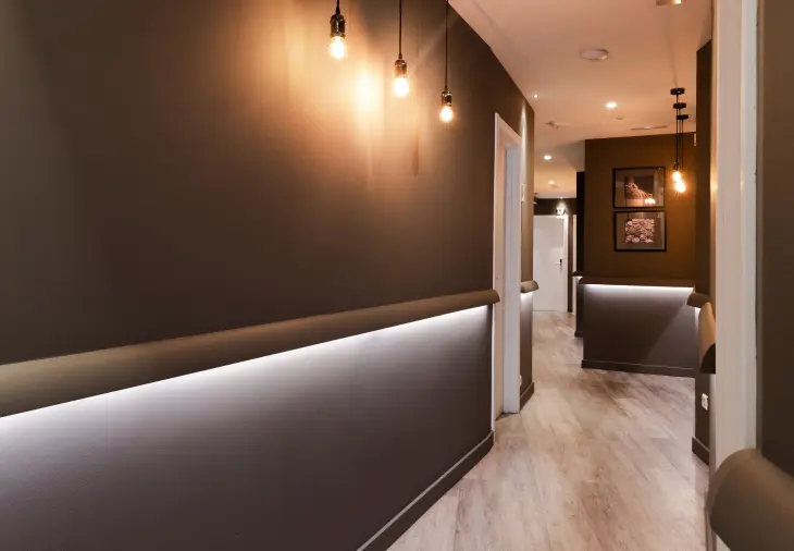 contemporary-basement-corridor-with-stylish-lighting-and-decor