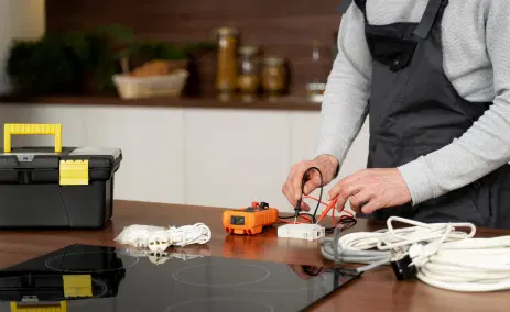 electrician-testing-an-appliance-on-a-kitchen-counter