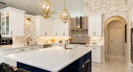 elegant-kitchen-with-marble-finishes-and-gold-light-fixtures.